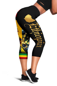 Black capri leggings with gold text and lion portrait graphic on thigh