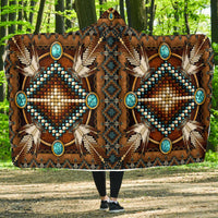 Brown hooded blanket, front view with large turquoise diamond bead medallion