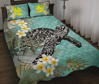 Teal bedspread with black turtle print and white plumeria blooms; two matching square pillows