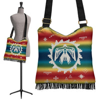 Rainbow Native-style crossbody handbag with fringe trim and black shoulder strap, front view