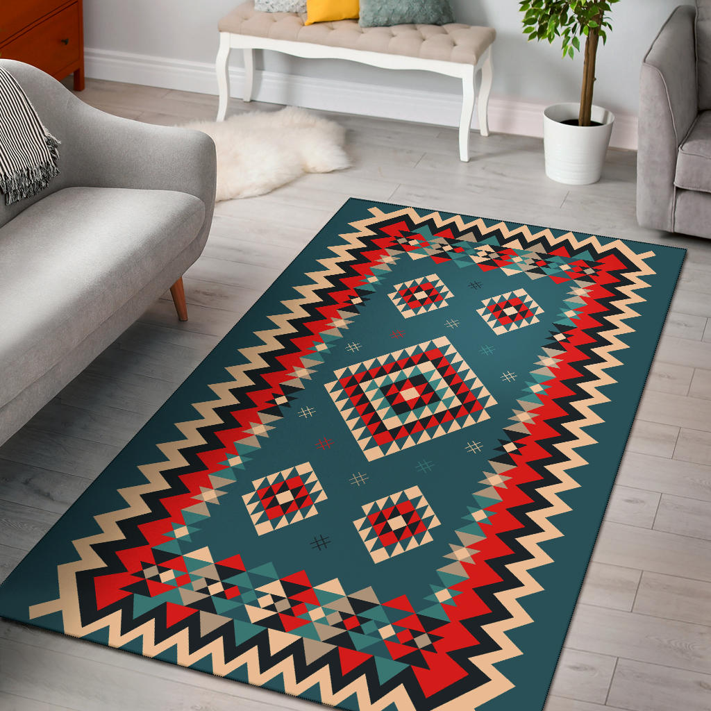 Teal ethnic geometric area rug with red diamond patterns and zigzag border