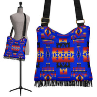 Dark blue crossbody bag with native tribal geometric pattern and fringe trim