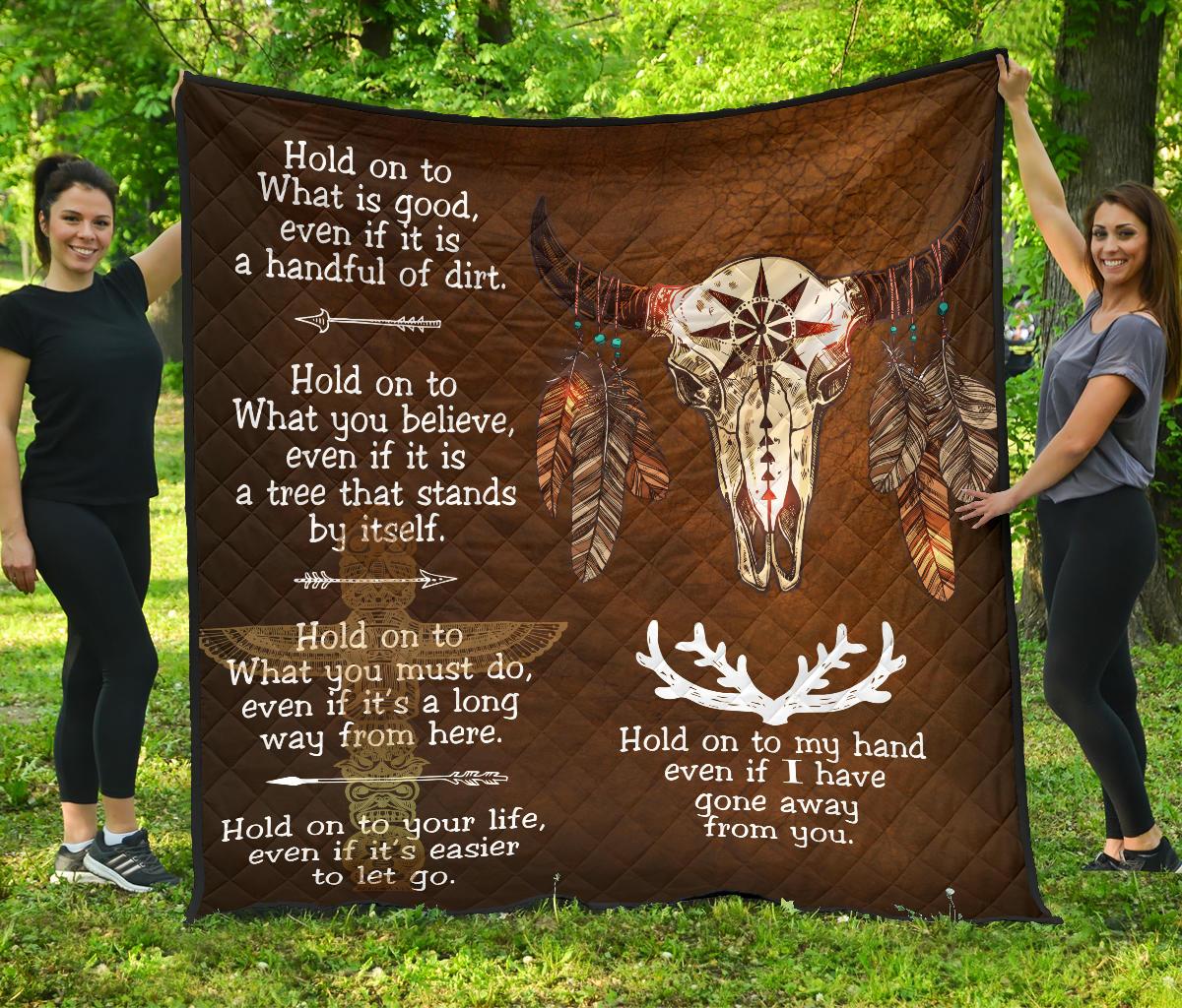 Brown premium quilt with bison head, feather details, and white Native-inspired quotes
