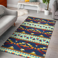 Blue Native American style area rug with geometric zigzags in orange, yellow, and light blue
