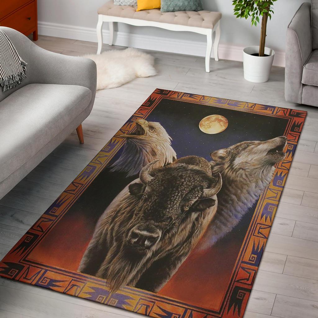 Multicolor area rug with wolf and bison under moon, bordered with geometric trim