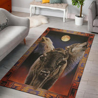 Multicolor area rug with wolf and bison under moon, bordered with geometric trim