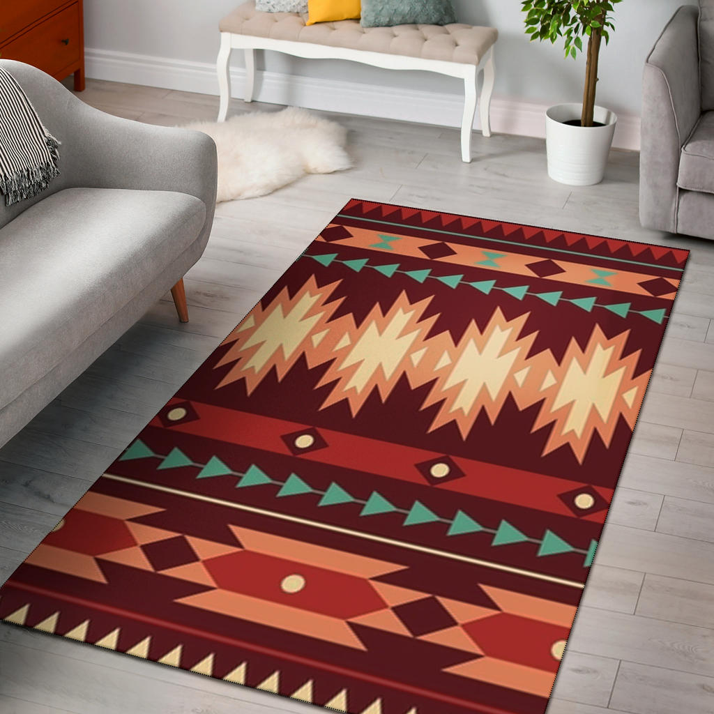 Red geometric ethnic area rug with zigzag, diamond, and green accents, rectangular