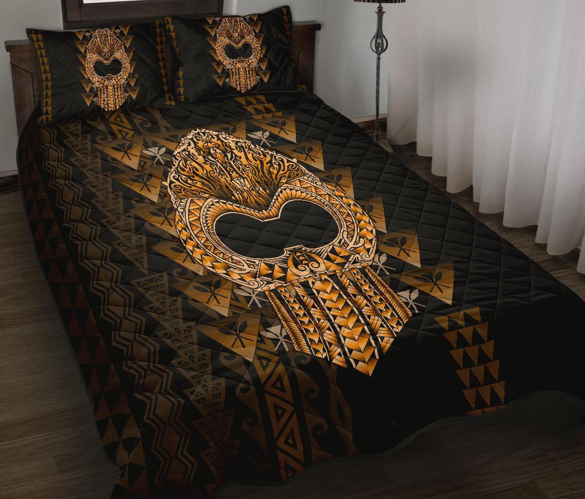 Black quilt bed set with golden Polynesian hand motif and quilted diamond pattern