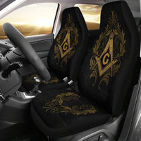 Black seat covers with gold Freemason emblem on headrest and seat cushion