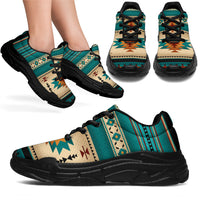 Blue Native-style chunky sneakers with teal/beige tribal pattern and black sole