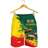 Wonder Print Shop Ethiopia graphic shorts on hanger, green yellow red splatter print
