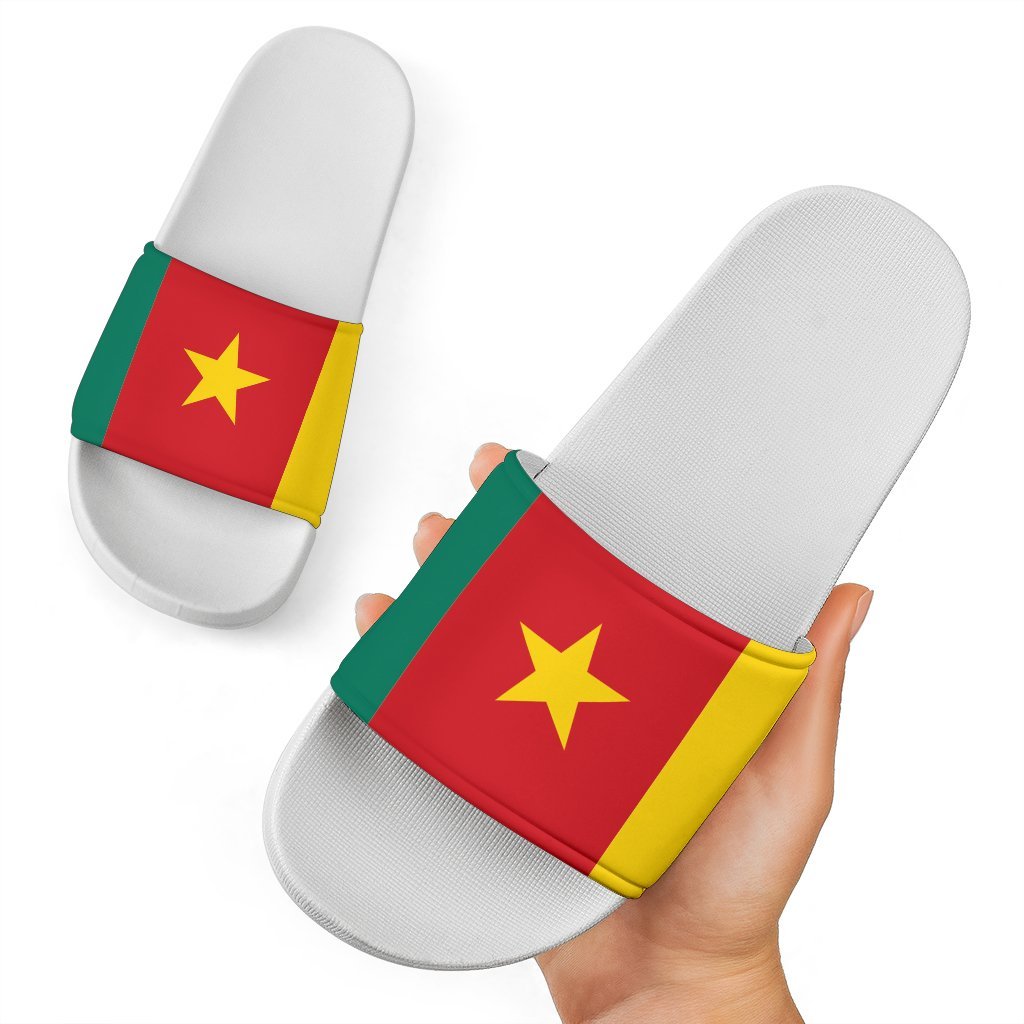 Cameroon slide sandals: light-colored slides with red/yellow flag strap and gold star