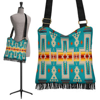 Turquoise boho shoulder bag with Native-style geometric pattern and black fringe hem