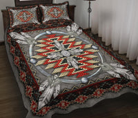 Native-style quilt bed set with gray base, central circular motif, red/cream beads, geometric border