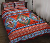 Red-and-turquoise quilt bed set with geometric patterns and 2 matching pillow shams
