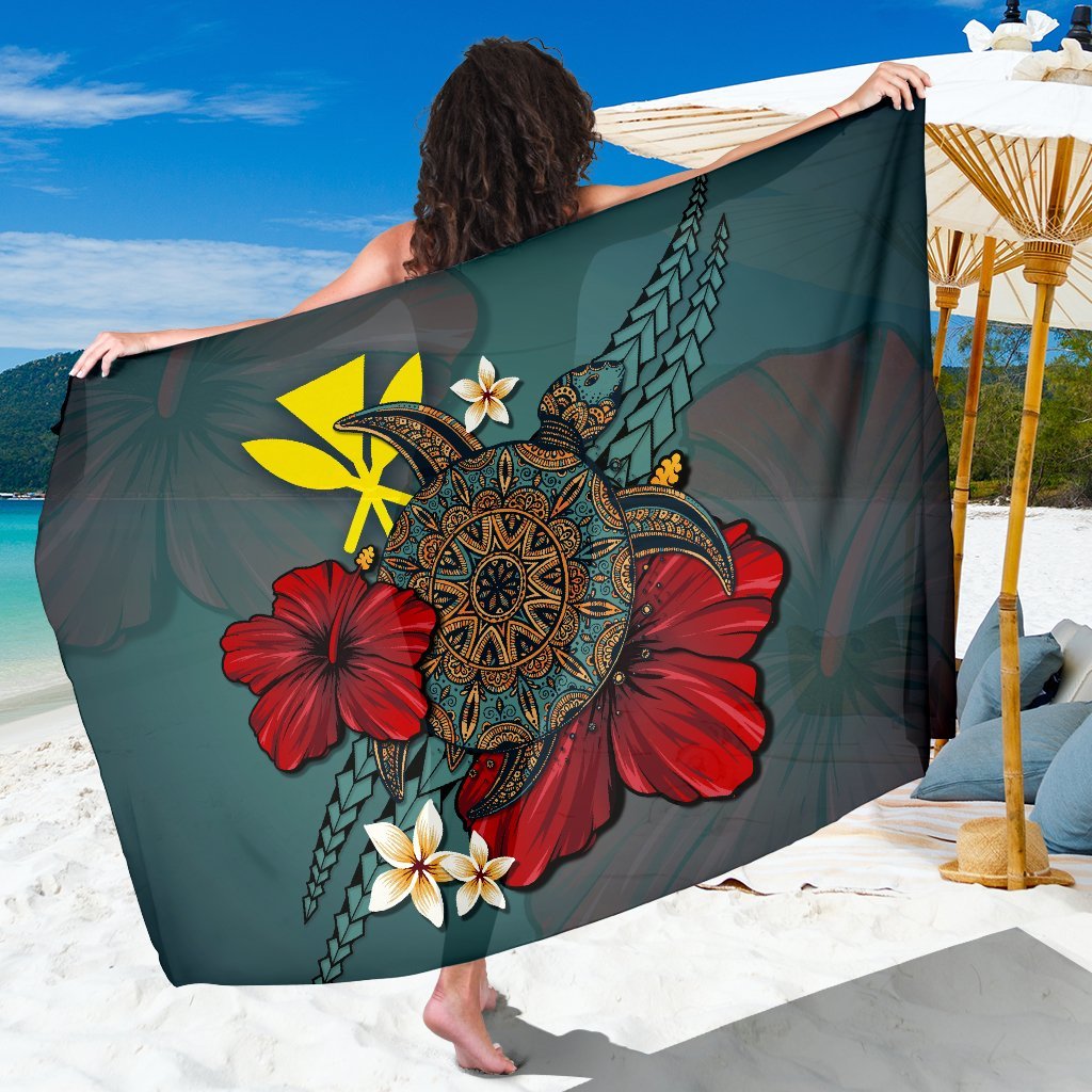 Green Hawaiian sarong blanket with red hibiscus and central turtle tribal design
