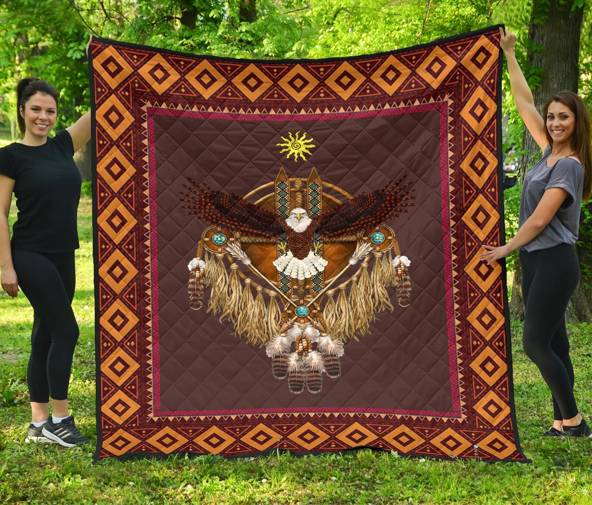 Multicolor native-style quilt with eagle and sun symbol, geometric diamond border, burgundy