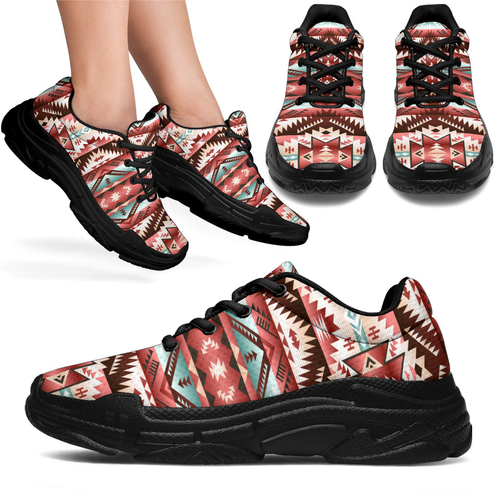 Red-and-teal tribal patterned chunky sneakers, black laces and black outsole, side view