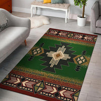 Green Native-style geometric area rug with central starburst and multicolor border stripes