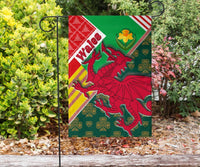 Garden flag on ground stake: green Wales design with red dragon, daffodil and “Wales”