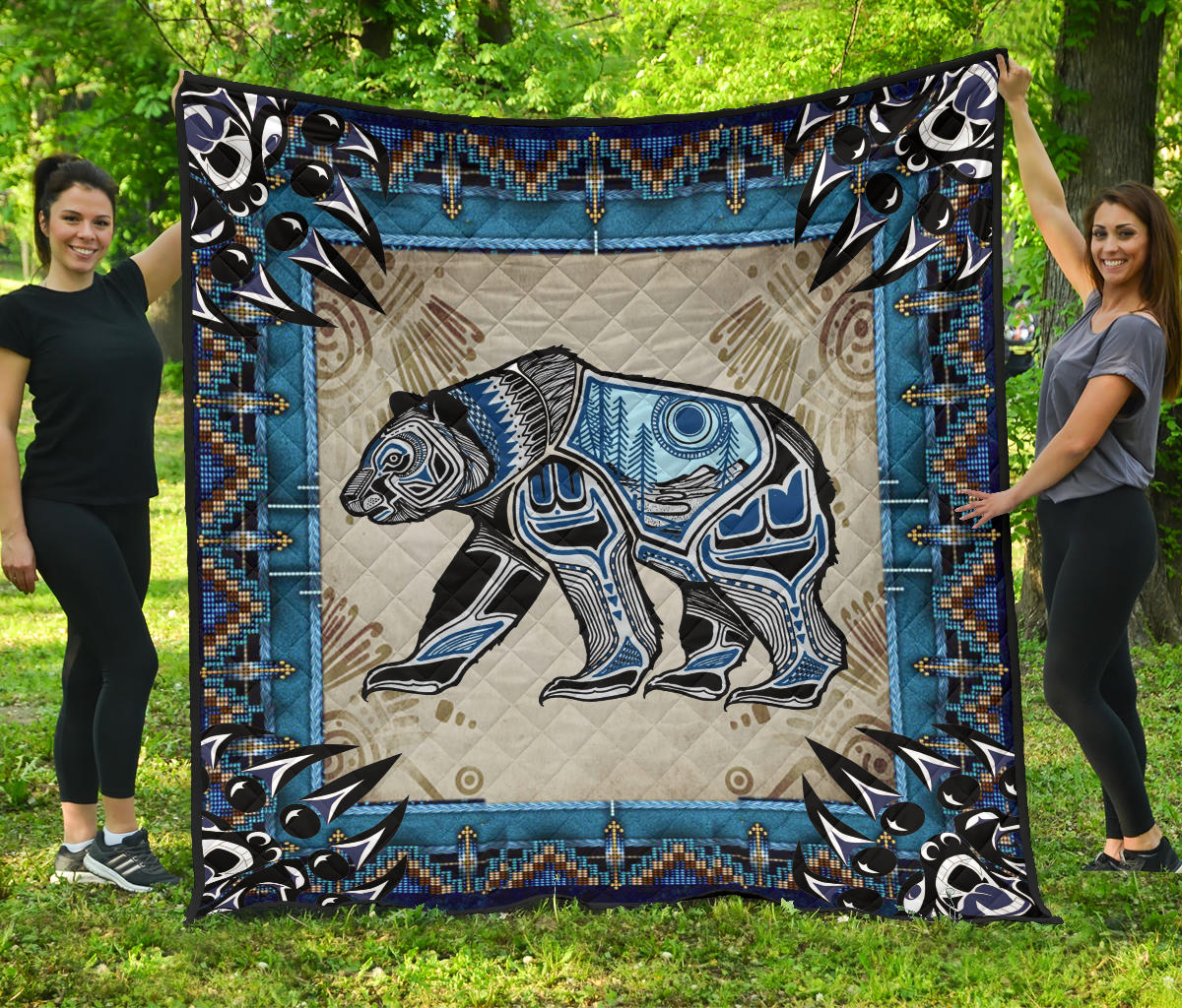 Bear symbol Native American quilt with blue border, black/white bear and tan geometric trim