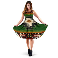 Sleeveless 3D graphic dress in green with black, tan, red geometric patterns
