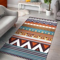 Geometric Native American–style area rug with multicolor striped bands and borders.
