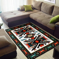 Colorful tribal patterned area rug on living room floor, black edge with red green accents