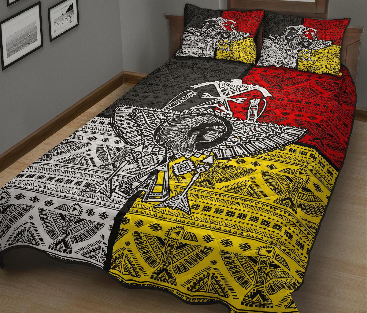 Colorful quilt bedding set with thunderbird motif and tribal patterns in red, yellow, black