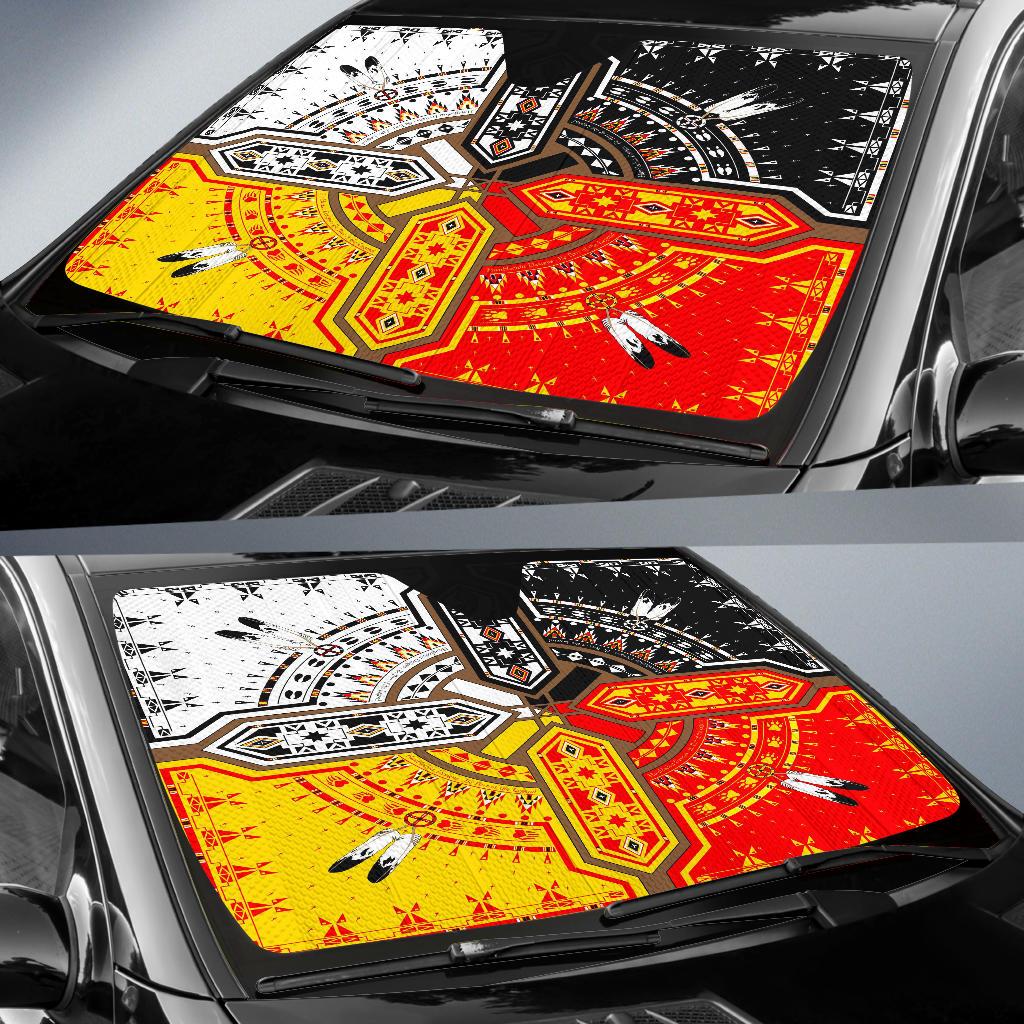Installed auto sun shade showing yellow, red and black geometric and feather designs