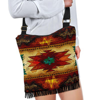 Colorful southwest crossbody bag with black strap and gold-tone buckle