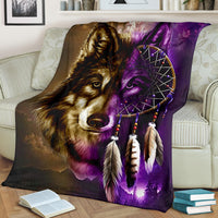 Close-up wolf and purple dreamcatcher graphic on a multicolor blanket