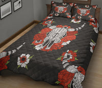 Black quilt with large bison and floral motif, diamond stitching; matching pillow set
