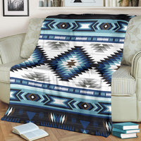 Tribal pattern blanket in blue and white with large star-like center and striped band