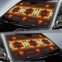 Colorful auto sun shade covering windshield with geometric Native-style motifs