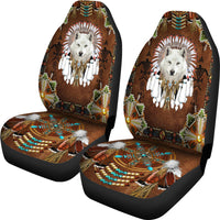 Two car seat covers with white wolf headdress, bead and feather tribal artwork