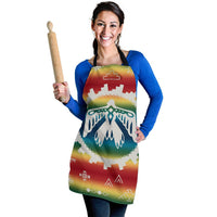 Colorful thunderbird apron worn over blue shirt, full front tribal pattern