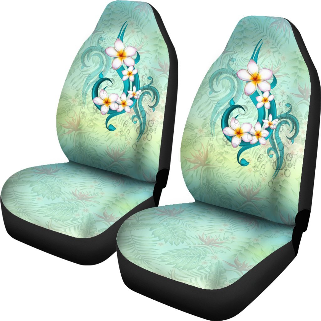 Turquoise Hawaiian car seat covers with plumeria flower and leaf pattern, black edges