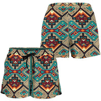 Back view women’s tribal print shorts, teal pattern with black drawstring waist, mid-length