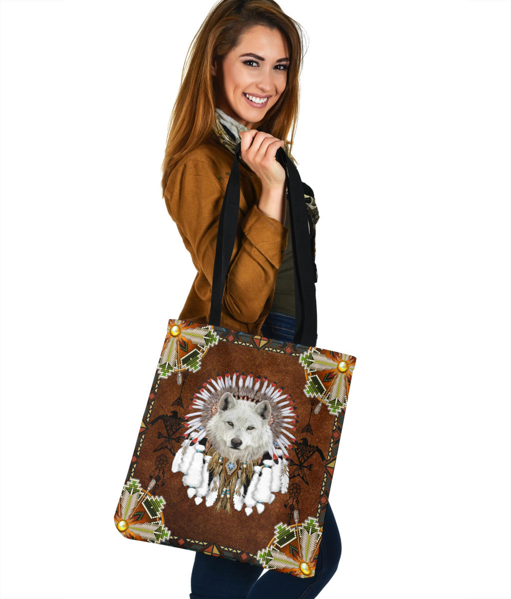 Wolf headdress tote bag, brown with green-red geometric trim and centered wolf face print