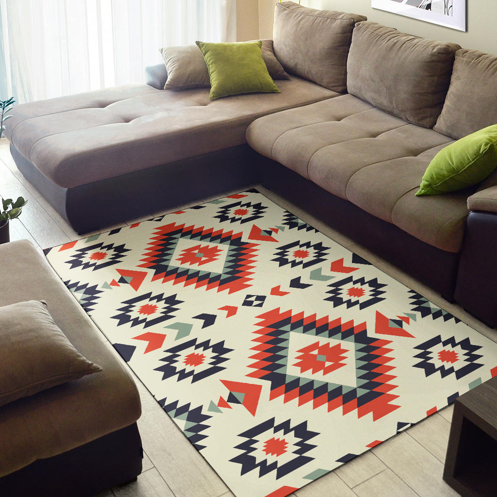 Geometric area rug, cream with navy, red and green arrow and star motifs