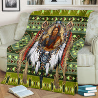 Green multicolor patterned chief blanket draped over chair with fringed portrait