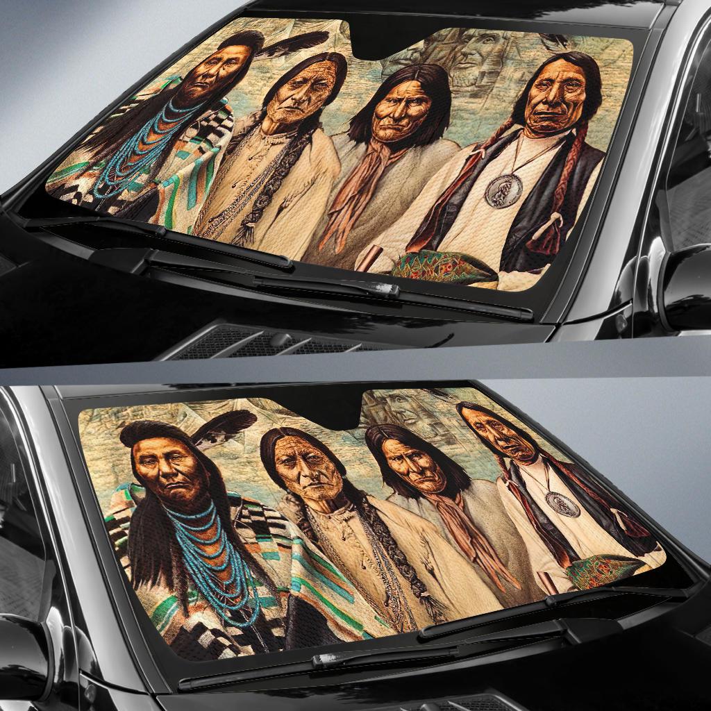 Installed auto sun shade showing four Native American portraits across the windshield
