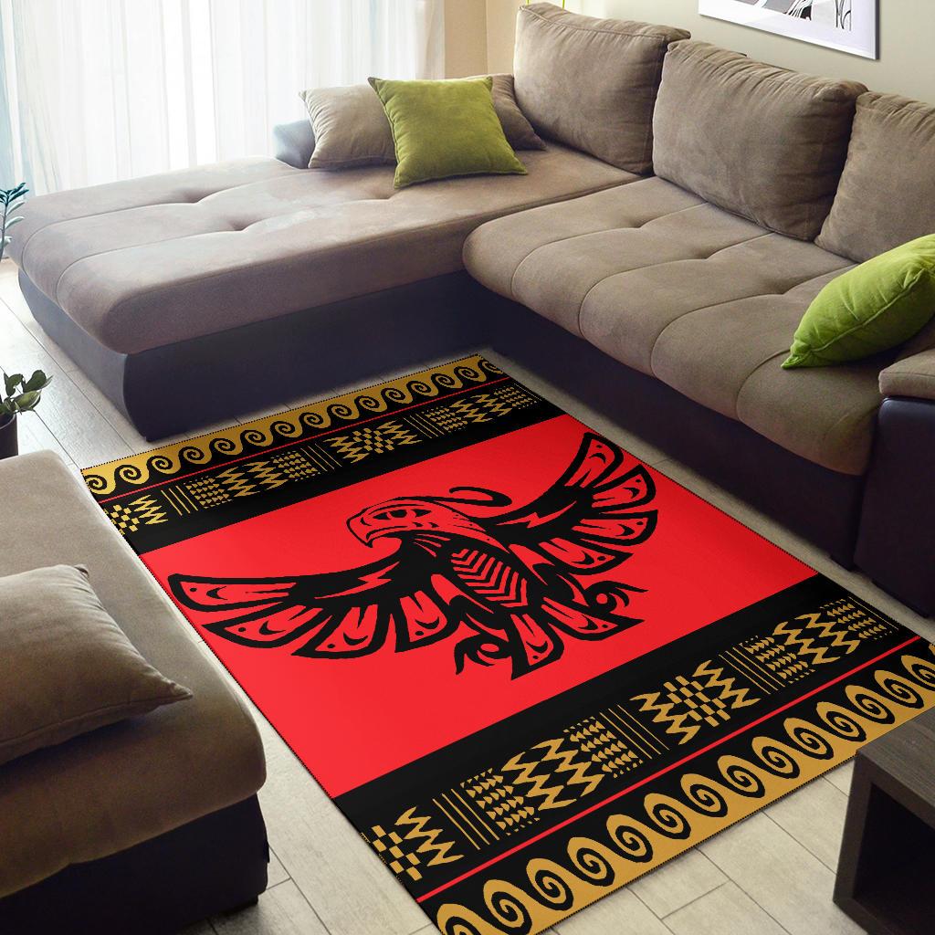 Red rug with black frame and gold geometric trim, eagle motif