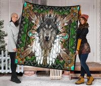 Wolf mandala quilt draped on door, green multicolor tribal artwork with black trim