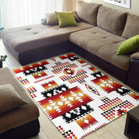 Tribal geometric area rug with white background and red, black, yellow pattern accents