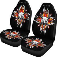 Pair of black car seat covers with bison skull and multicolor starburst designs