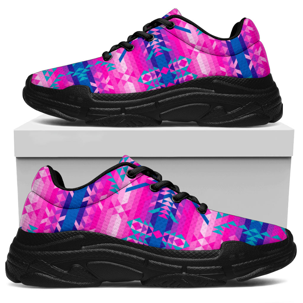 Pink and teal patterned chunky sneakers with black chunky outsole and lace-up front