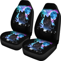 Set of car seat covers featuring wolf portrait with starry blue moon over trees