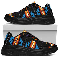 Black chunky sneaker with colorful geometric print, thick sole, and black laces